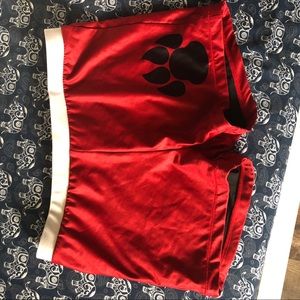 Red spandex with paw print
